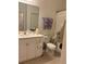 Bathroom with tub, toilet and vanity at 10923 Blue Magnolia Ln, Parrish, FL 34219