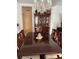 Formal dining room with a hutch and a large wooden table at 10923 Blue Magnolia Ln, Parrish, FL 34219