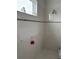 Bright shower featuring clean white tile and minimalist design at 10923 Blue Magnolia Ln, Parrish, FL 34219