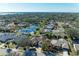 Aerial view showcasing a house with a pond and lush green surroundings at 1104 83Rd Nw St, Bradenton, FL 34209