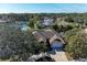 An aerial view of a single-Gathering home with a large yard and a pond nearby at 1104 83Rd Nw St, Bradenton, FL 34209