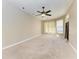 Bright bedroom featuring a ceiling fan and carpet flooring at 1104 83Rd Nw St, Bradenton, FL 34209