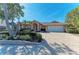 Single-Gathering home with a two-car garage and manicured landscaping at 1104 83Rd Nw St, Bradenton, FL 34209