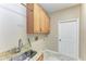 Laundry room with cabinets and utility sink at 1104 83Rd Nw St, Bradenton, FL 34209