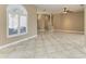 Living room with arched window and tile floors at 1104 83Rd Nw St, Bradenton, FL 34209