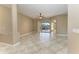 Spacious living room with tile floors, sliding doors to pool area, and ceiling fan at 1104 83Rd Nw St, Bradenton, FL 34209