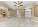 Open living space with tile floors, ceiling fan and views of kitchen and entry at 1104 83Rd Nw St, Bradenton, FL 34209