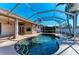 Large kidney shaped swimming pool with screened enclosure at 1104 83Rd Nw St, Bradenton, FL 34209