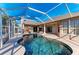 Inviting kidney-shaped pool with a screened enclosure at 1104 83Rd Nw St, Bradenton, FL 34209