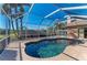 Relaxing kidney-shaped pool with a screened enclosure in the backyard at 1104 83Rd Nw St, Bradenton, FL 34209