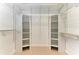 Large walk-in closet with custom shelving and rods at 1104 83Rd Nw St, Bradenton, FL 34209