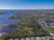 Aerial view highlighting the property's position near the water and other houses at 11264 28Th Street E Cir, Parrish, FL 34219