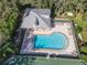 Community pool and tennis courts with covered seating area at 11264 28Th Street E Cir, Parrish, FL 34219