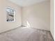 Well-lit bedroom with neutral carpeting and window at 11264 28Th Street E Cir, Parrish, FL 34219