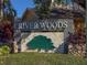 River Woods community entrance sign with green tree logo at 11264 28Th Street E Cir, Parrish, FL 34219