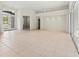 Large living room with tile floors and multiple access points at 11264 28Th Street E Cir, Parrish, FL 34219