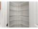 Walk-in pantry with wire shelving for ample storage at 11264 28Th Street E Cir, Parrish, FL 34219