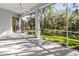 Screened porch overlooking a lush green backyard at 11264 28Th Street E Cir, Parrish, FL 34219