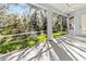 Bright screened porch with ceiling fan and view of nature at 11264 28Th Street E Cir, Parrish, FL 34219