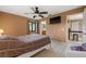 Cozy bedroom with a comfortable bed, built-in TV, and access to a private bathroom at 1170 Richter St, Port Charlotte, FL 33952