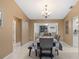 Bright dining room features a table with seating for six and a view into the living room at 1170 Richter St, Port Charlotte, FL 33952