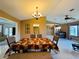 Well-lit dining room, featuring a large table with patterned tablecloth at 1170 Richter St, Port Charlotte, FL 33952