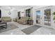 Living room with patio doors leading to the pool area at 1170 Richter St, Port Charlotte, FL 33952