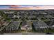 Aerial view of a home at sunset in a quiet neighborhood at 11712 Golden Bay Pl, Bradenton, FL 34211