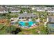 Community pool with a clubhouse and surrounding landscape at 11712 Golden Bay Pl, Bradenton, FL 34211