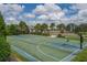 Community basketball court with two hoops at 11712 Golden Bay Pl, Bradenton, FL 34211