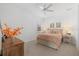 Bright bedroom featuring a comfortable bed and neutral decor at 11712 Golden Bay Pl, Bradenton, FL 34211