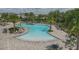 Resort-style pool with lounge chairs and palm trees at 11712 Golden Bay Pl, Bradenton, FL 34211