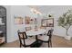 Elegant dining room features a marble table and rattan chairs at 11712 Golden Bay Pl, Bradenton, FL 34211