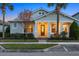 Craftsman style home with front porch and landscaping at dusk at 11712 Golden Bay Pl, Bradenton, FL 34211