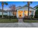 Craftsman style home with front porch and landscaping at dusk at 11712 Golden Bay Pl, Bradenton, FL 34211