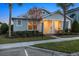 Craftsman style home with front porch and landscaping at dusk at 11712 Golden Bay Pl, Bradenton, FL 34211