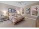 Spacious bedroom with king bed, neutral decor, and large windows with plantation shutters at 11712 Golden Bay Pl, Bradenton, FL 34211