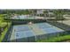 Two pristine pickleball courts near pool at 11712 Golden Bay Pl, Bradenton, FL 34211