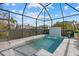 Sparkling pool with a tiled waterfall feature and screened enclosure at 11712 Golden Bay Pl, Bradenton, FL 34211