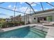 Relaxing pool and patio area with covered lanai, creating an outdoor oasis at 11712 Golden Bay Pl, Bradenton, FL 34211