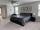 Spacious bedroom with plush carpeting and ceiling fan at 12315 Ballentrae Forest Dr, Riverview, FL 33579