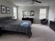 Main bedroom with a large bed, dresser and chair at 12315 Ballentrae Forest Dr, Riverview, FL 33579