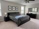 Main bedroom with a king-size bed and dresser at 12315 Ballentrae Forest Dr, Riverview, FL 33579