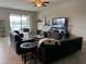 Living room with lake view, leather couches, and a coffee table at 12315 Ballentrae Forest Dr, Riverview, FL 33579