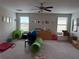 Large playroom with lots of natural light and carpet flooring at 12315 Ballentrae Forest Dr, Riverview, FL 33579