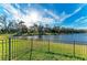 Private backyard with scenic lake view and fence at 13823 Swiftwater Way, Bradenton, FL 34211