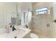 Modern bathroom with updated vanity, a large mirror and a walk-in shower at 13823 Swiftwater Way, Bradenton, FL 34211