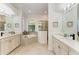 Elegant bathroom with double vanity, soaking tub, and shower at 13823 Swiftwater Way, Bradenton, FL 34211