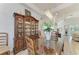 Bright dining room with a beautiful chandelier and built-in hutch at 13823 Swiftwater Way, Bradenton, FL 34211