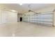 Spacious two-car garage with epoxy floor and extra storage at 13823 Swiftwater Way, Bradenton, FL 34211